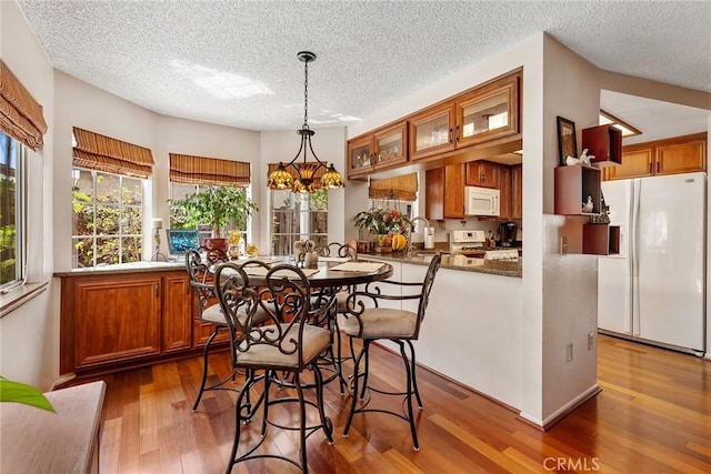 19852 Pandy Ct, Canyon Country, CA 91351 - dining room with wood finished floors and a textured ceiling