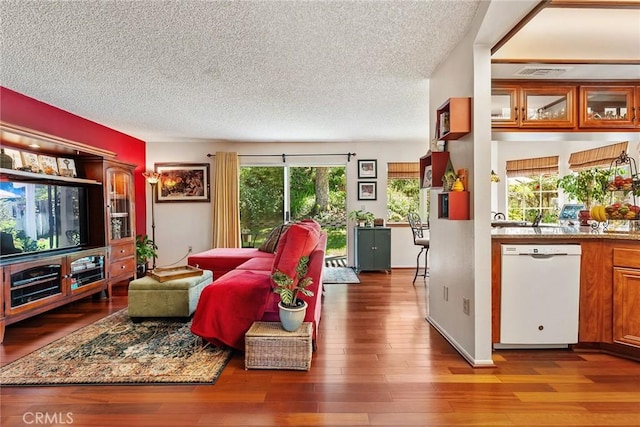 19852 Pandy Ct, Canyon Country, CA 91351 - living room with wood finished floors, a textured ceiling, and visible vents