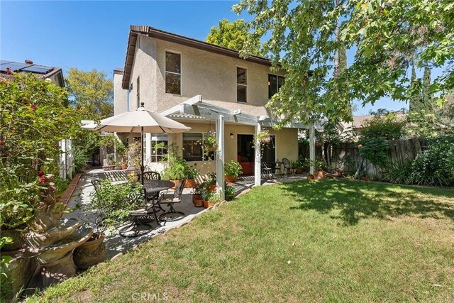 19852 Pandy Ct, Canyon Country, CA 91351 - back of house with a lawn, fence, a patio, and stucco siding