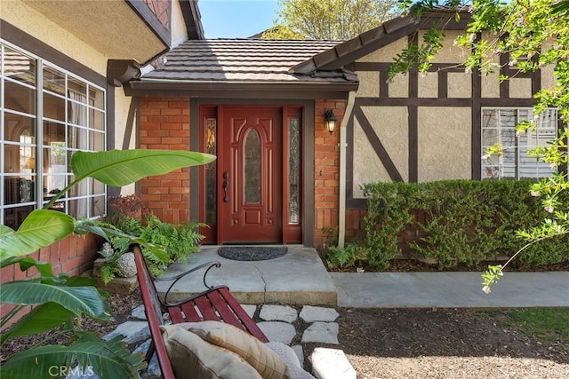 19852 Pandy Ct, Canyon Country, CA 91351 - doorway to property with stucco siding, a tile roof, and brick siding
