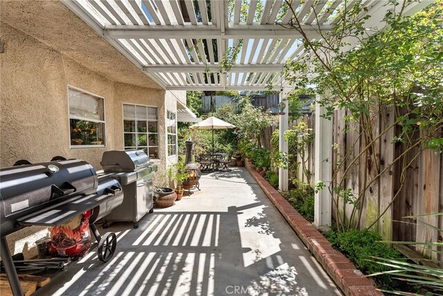 19852 Pandy Ct, Canyon Country, CA 91351 - view of patio featuring a pergola, outdoor dining space, area for grilling, and fence