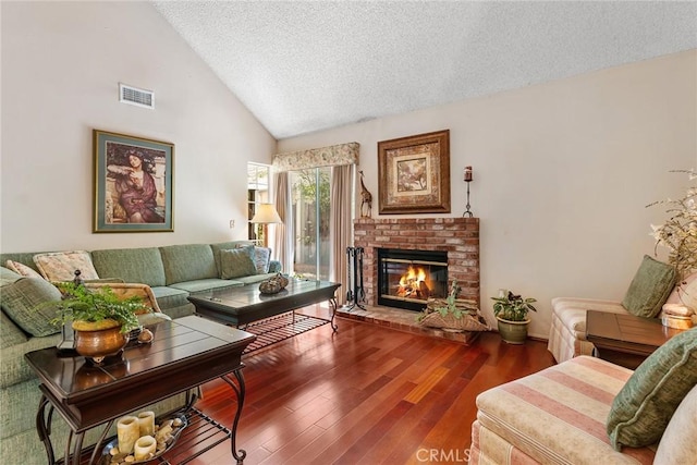 19852 Pandy Ct, Canyon Country, CA 91351 - living room with wood finished floors, a brick fireplace, visible vents, a textured ceiling, and high vaulted ceiling