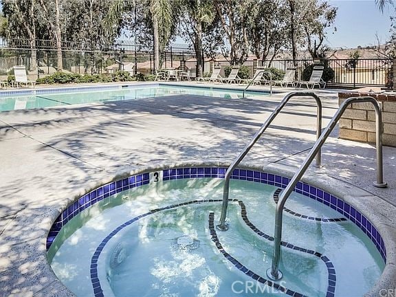 19852 Pandy Ct, Canyon Country, CA 91351 - pool featuring a hot tub, a patio area, and fence