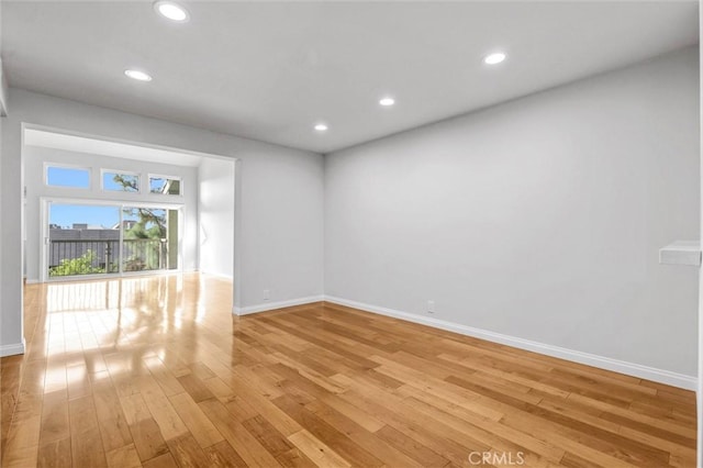 18324 Clark St Unit 315, Tarzana, CA 91356 - unfurnished room with baseboards, light wood finished floors, and recessed lighting