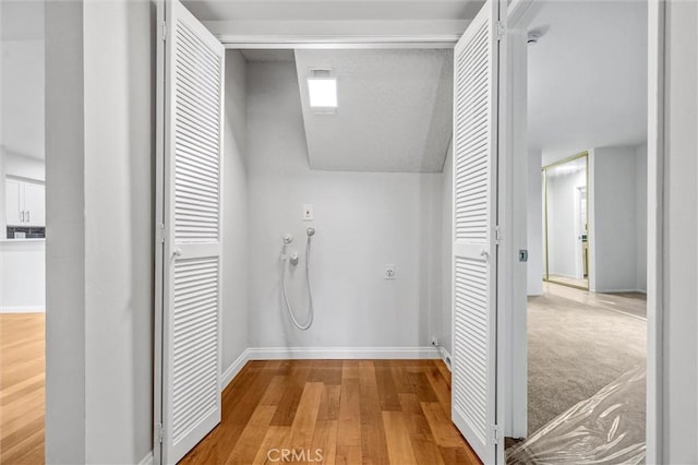 18324 Clark St Unit 315, Tarzana, CA 91356 - corridor featuring baseboards and wood finished floors