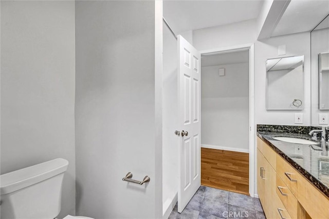 18324 Clark St Unit 315, Tarzana, CA 91356 - bathroom featuring baseboards, toilet, and vanity