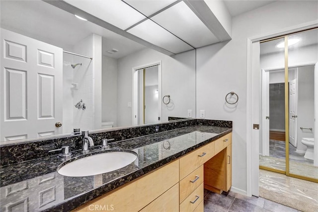 18324 Clark St Unit 315, Tarzana, CA 91356 - full bathroom with baseboards, vanity, a shower, and toilet