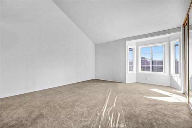 18324 Clark St Unit 315, Tarzana, CA 91356 - carpeted empty room with lofted ceiling