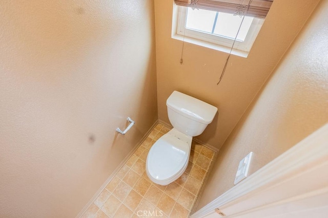 bathroom featuring toilet