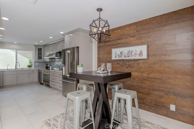 4738 E Fairfield St, Anaheim Hills, CA 92807 - dining area with wooden walls, recessed lighting, and a chandelier
