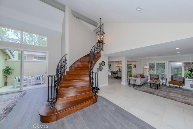 4738 E Fairfield St, Anaheim Hills, CA 92807 - stairway featuring a chandelier, high vaulted ceiling, recessed lighting, and baseboards