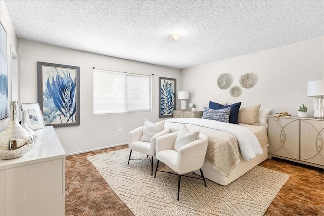 carpeted bedroom featuring a textured ceiling