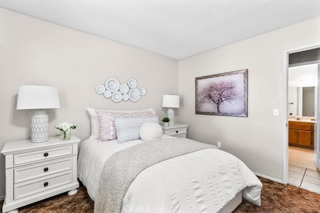 bedroom with dark carpet and a textured ceiling