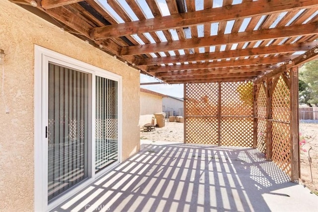 view of patio / terrace with fence and a pergola