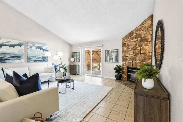 living room featuring a fireplace, lofted ceiling, a textured ceiling, and light tile patterned floors