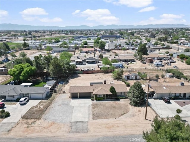 drone / aerial view featuring a mountain view and a residential view