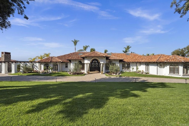 5955 Lake Vista Dr, Bonsall, CA 92003 - mediterranean / spanish-style house with a front lawn, stucco siding, and a tiled roof