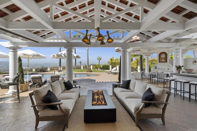 5955 Lake Vista Dr, Bonsall, CA 92003 - view of patio / terrace with exterior bar, an outdoor living space with a fire pit, and an outdoor pool