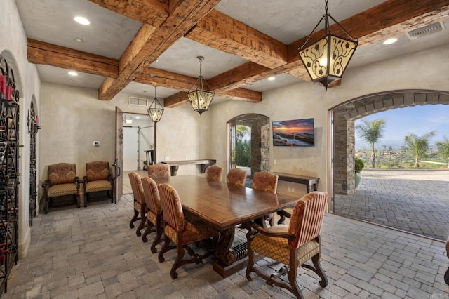 5955 Lake Vista Dr, Bonsall, CA 92003 - dining area featuring visible vents, arched walkways, coffered ceiling, and beamed ceiling