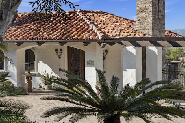 5955 Lake Vista Dr, Bonsall, CA 92003 - view of front of property featuring stucco siding, a chimney, and a tile roof