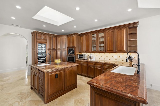 5955 Lake Vista Dr, Bonsall, CA 92003 - kitchen with a sink, a skylight, open shelves, and backsplash