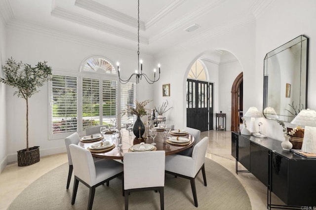 5955 Lake Vista Dr, Bonsall, CA 92003 - dining room with a healthy amount of sunlight, arched walkways, ornamental molding, and a notable chandelier