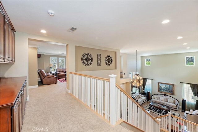 1560 Vandagriff Way, Corona, CA 92883 - hallway featuring a chandelier, recessed lighting, plenty of natural light, light carpet, and an upstairs landing