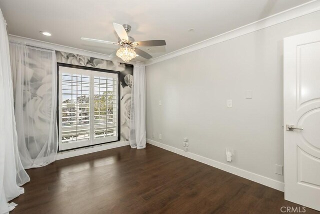 unfurnished room featuring baseboards, ornamental molding, a ceiling fan, and wood finished floors