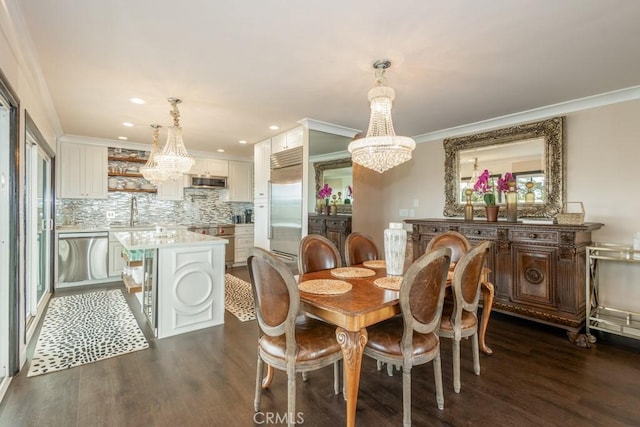 102 Scholz Unit 28, Newport Beach, CA 92663 - dining space featuring a chandelier, dark wood-type flooring, ornamental molding, and recessed lighting