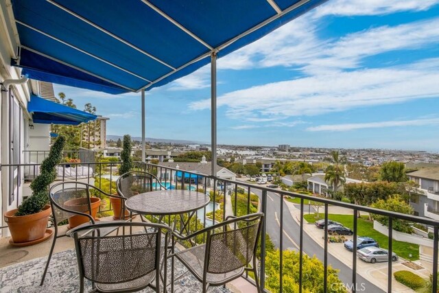balcony featuring a sunroom