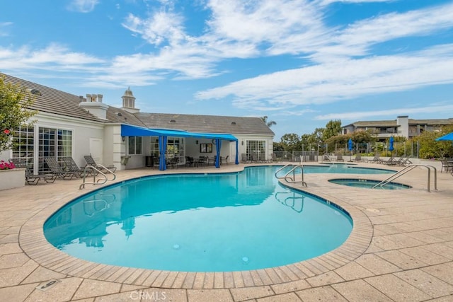 102 Scholz Unit 28, Newport Beach, CA 92663 - community pool featuring a community hot tub, a patio area, and fence