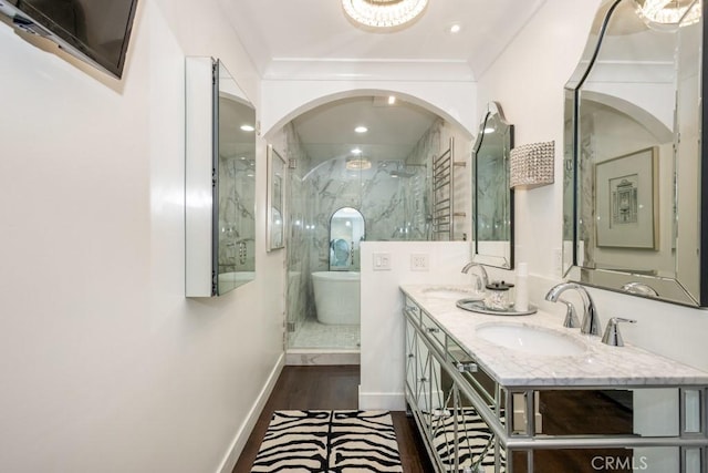 102 Scholz Unit 28, Newport Beach, CA 92663 - full bathroom featuring wood finished floors, walk in shower, double vanity, a freestanding bath, and recessed lighting