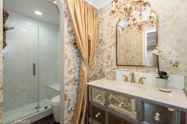 102 Scholz Unit 28, Newport Beach, CA 92663 - bathroom featuring wallpapered walls, toilet, a stall shower, vanity, and a chandelier