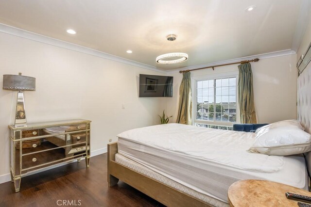 bedroom with recessed lighting, baseboards, dark wood finished floors, and ornamental molding