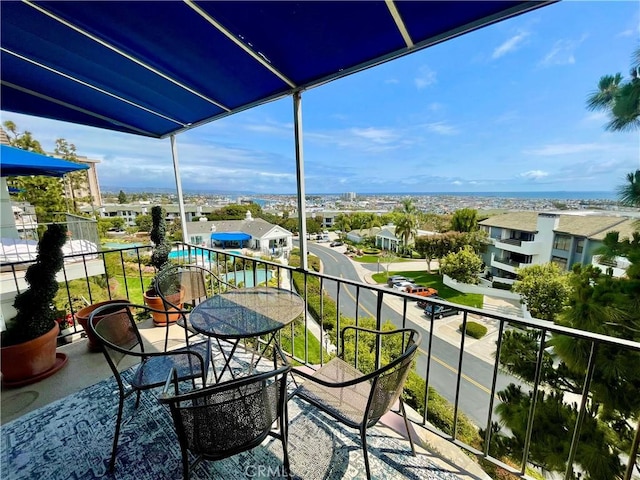 102 Scholz Unit 28, Newport Beach, CA 92663 - balcony with a sunroom and view of pool
