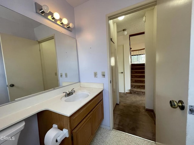 bathroom featuring vanity and a textured ceiling