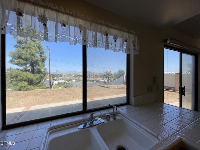 interior space featuring tile countertops
