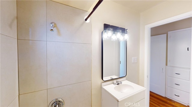 bathroom featuring wood finished floors and vanity