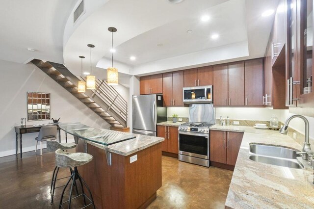 3980 9th Ave Unit 202, San Diego, CA 92103 - kitchen with a center island, a sink, stainless steel appliances, a raised ceiling, and visible vents