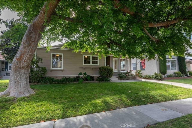 5032 Verdura Ave, Lakewood, CA 90712 - obstructed view of property with a front lawn