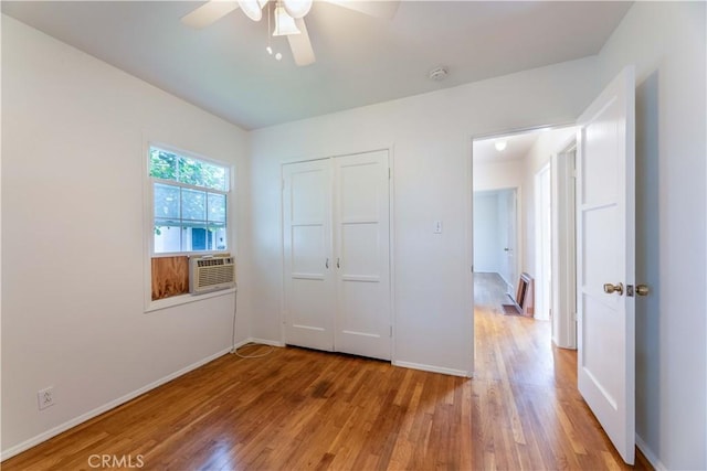 5032 Verdura Ave, Lakewood, CA 90712 - unfurnished bedroom with light wood-type flooring, cooling unit, baseboards, a ceiling fan, and a closet