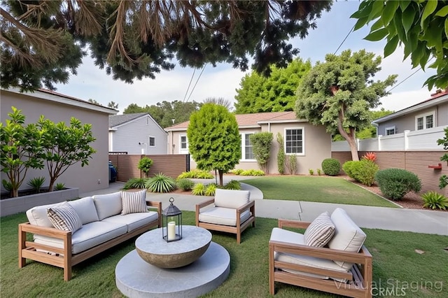 view of patio / terrace featuring an outdoor living space and fence