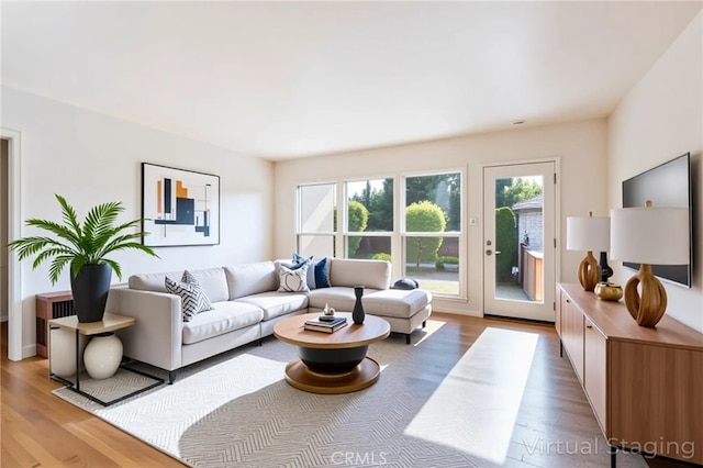 5032 Verdura Ave, Lakewood, CA 90712 - living room featuring wood finished floors