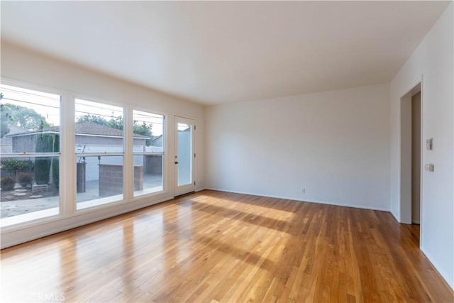 spare room with light wood finished floors
