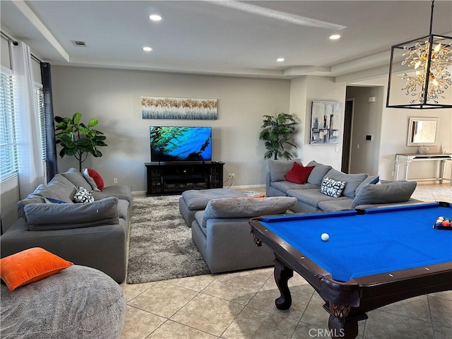 game room featuring a tray ceiling, visible vents, recessed lighting, and light tile patterned flooring