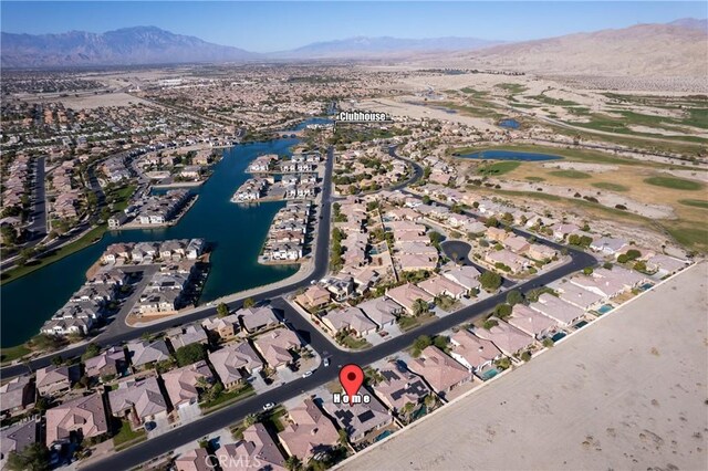 bird's eye view featuring a water and mountain view and a residential view