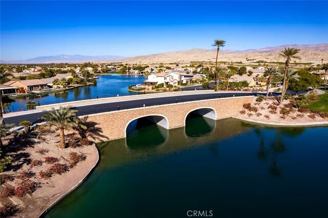 view of pool featuring a water and mountain view and a residential view