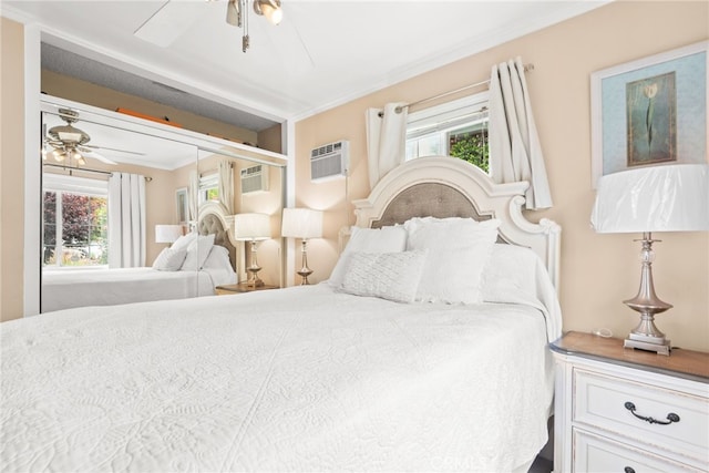 bedroom featuring crown molding, a ceiling fan, and a wall mounted AC
