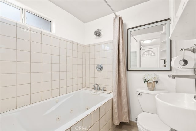 bathroom featuring tile patterned floors, a combined bath / shower with jetted tub, and toilet