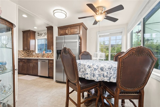 dining room with a ceiling fan and recessed lighting